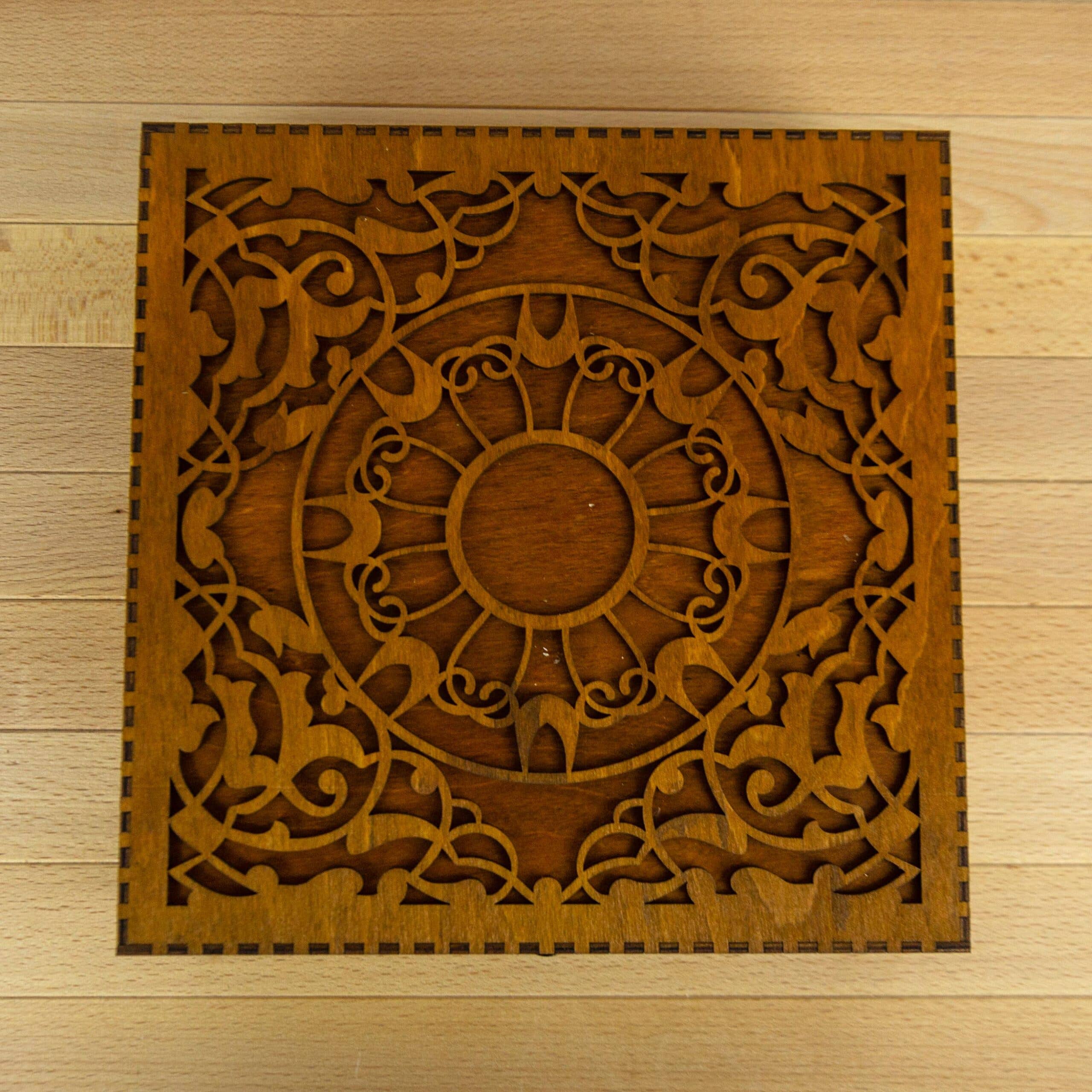 Engraved wooden box for embroidery bobbins