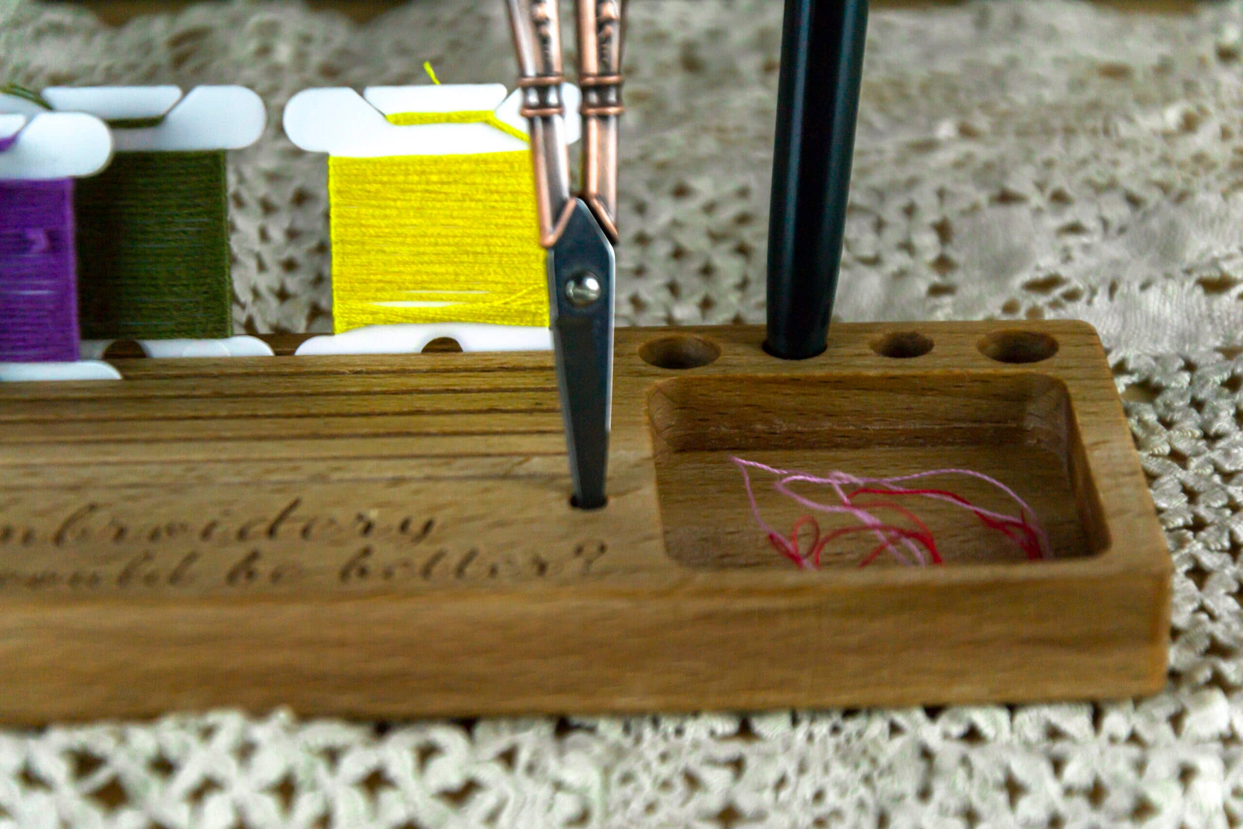 Phone holder organiser for needles, scissors and bobbins