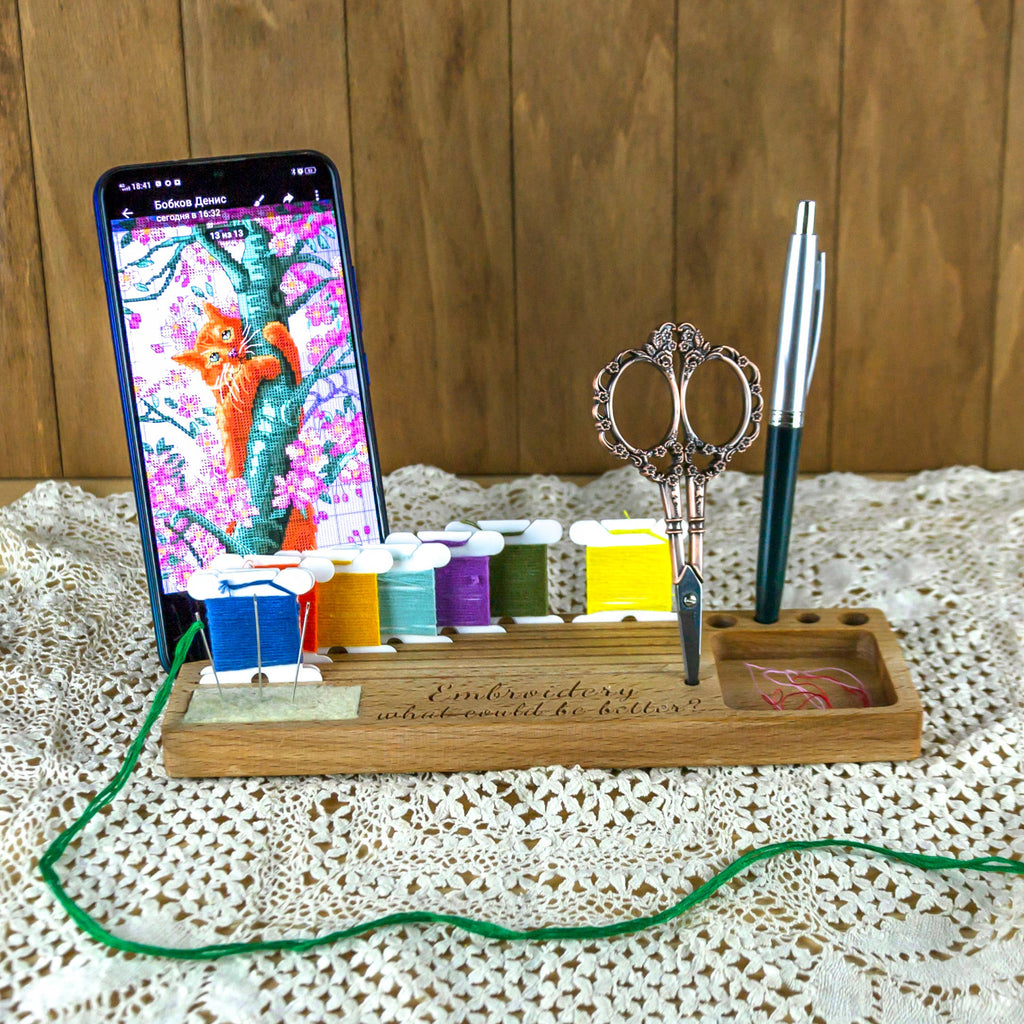 Phone holder organiser for needles, scissors and bobbins