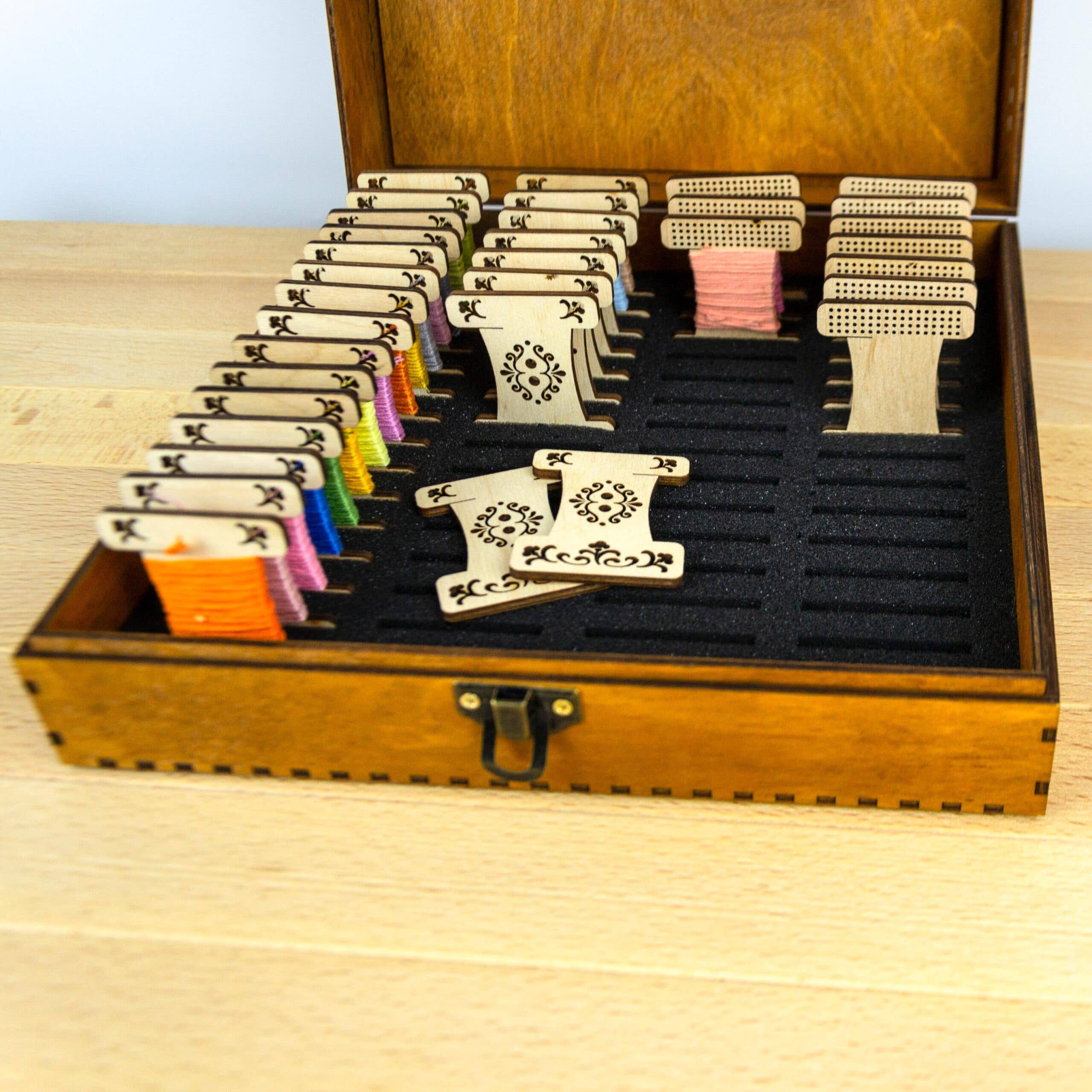 Engraved wooden box for embroidery bobbins