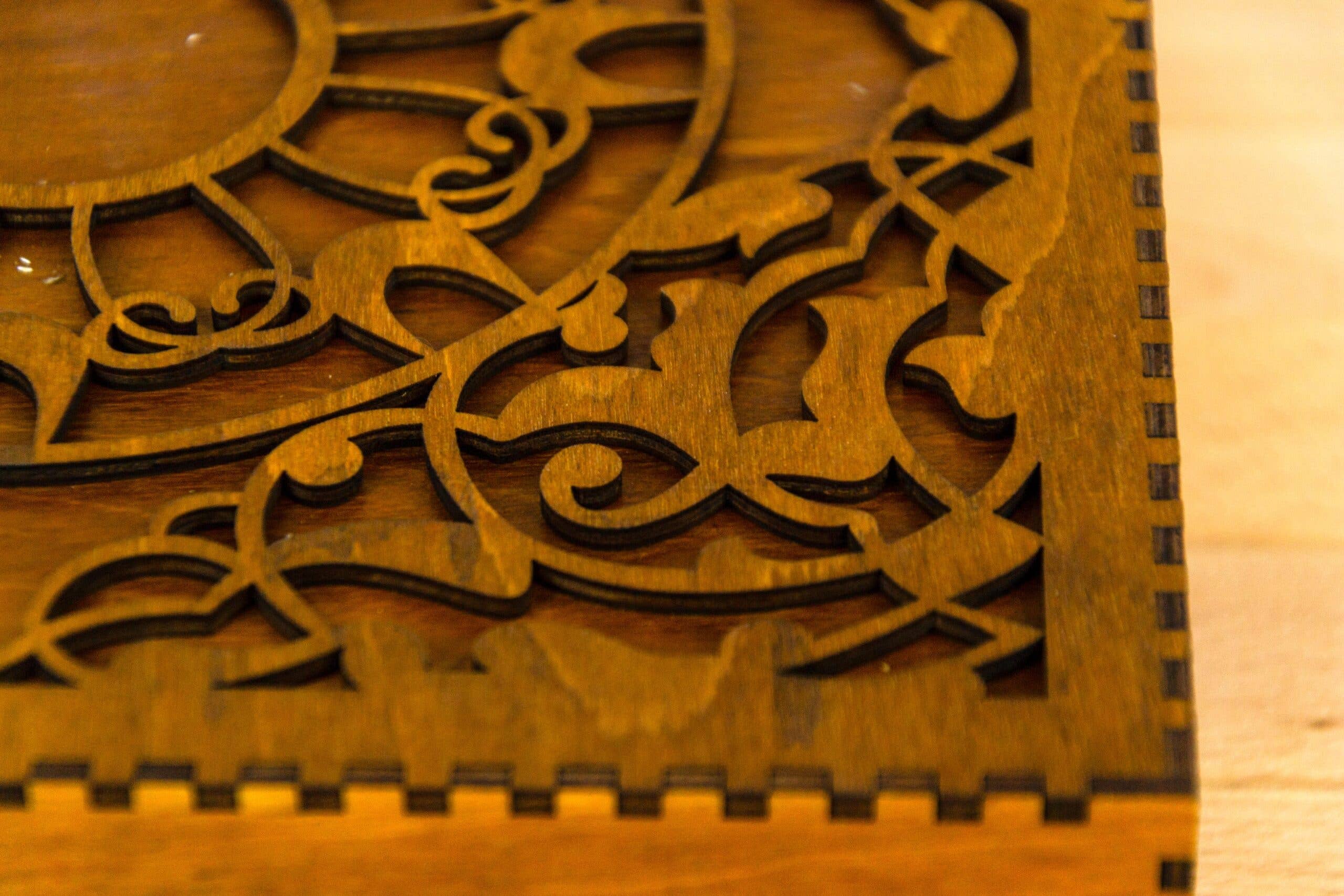 Engraved wooden box for embroidery bobbins