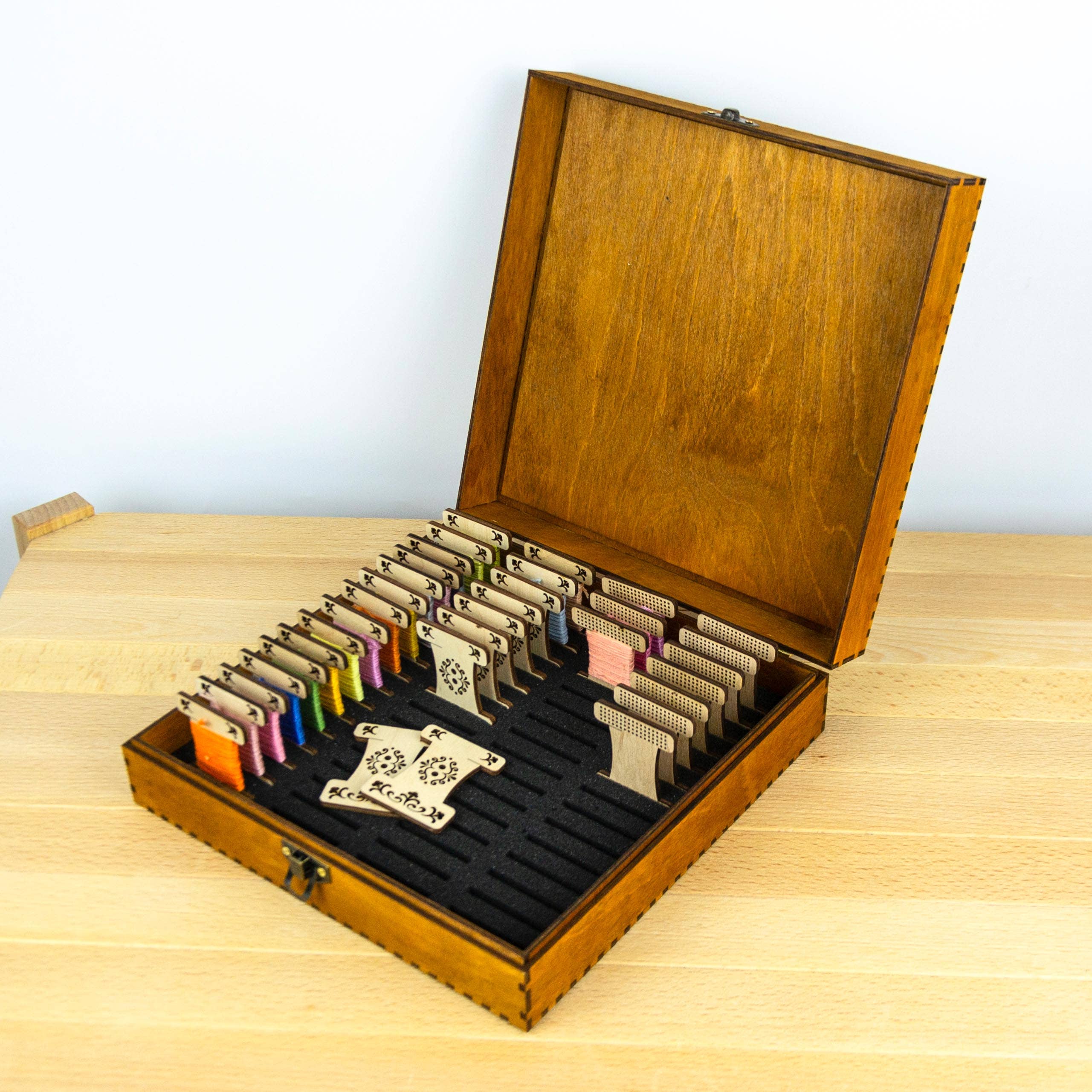 Engraved wooden box for embroidery bobbins